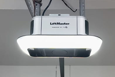 Installed LiftMaster belt drive garage door opener with integrated LED lighting.